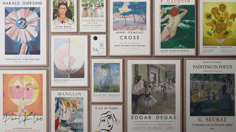 Gallery wall featuring a PSTR curated collection of posters in various styles and pastel tones, all framed