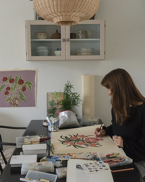 La Poire in the studio surrounded by sketches