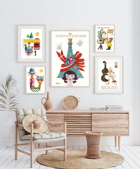 Framed Ib Antoni posters in a warm, Scandinavian-style interior with wooden furniture and neutral decor